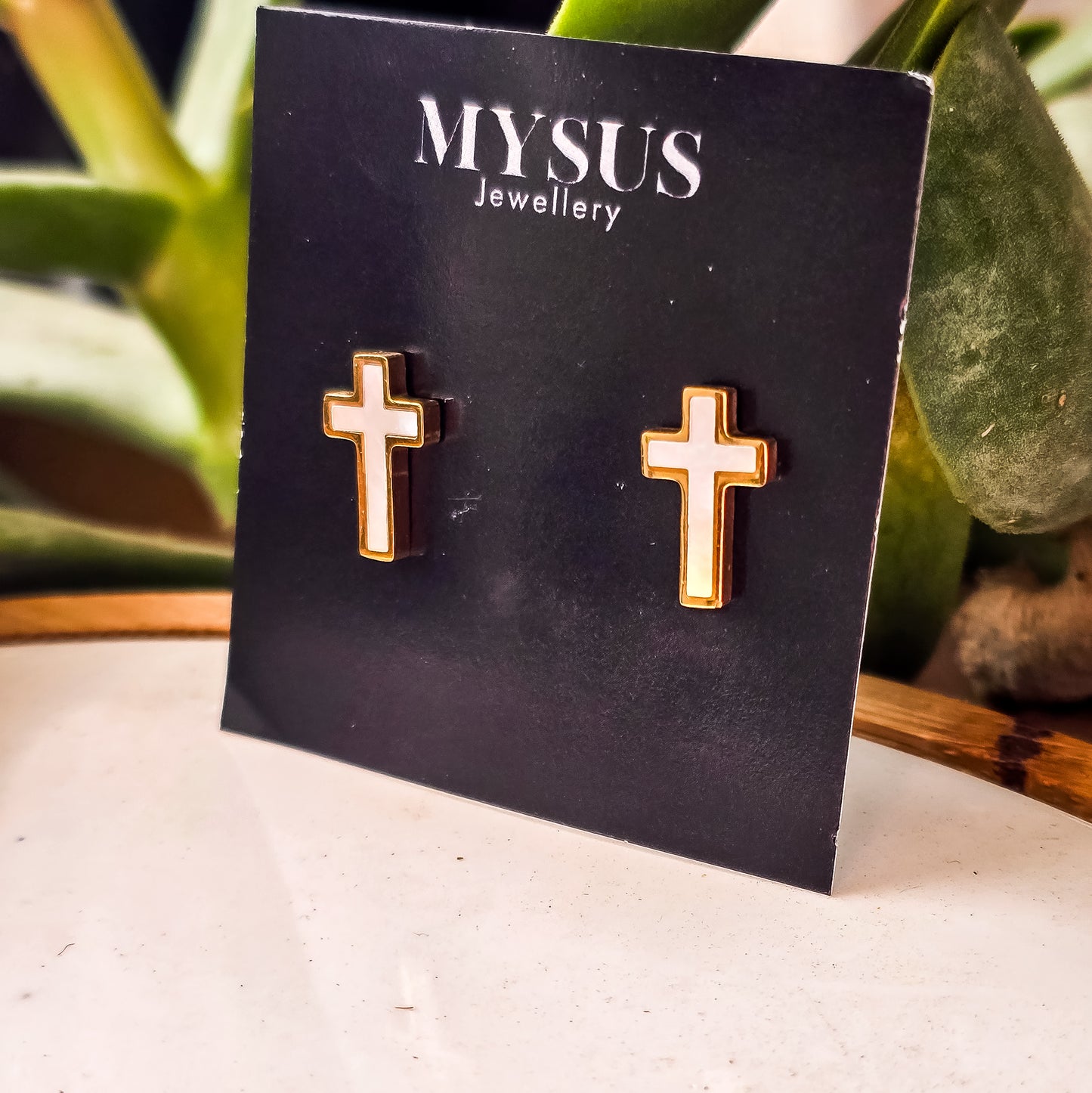 White cross stud earrings