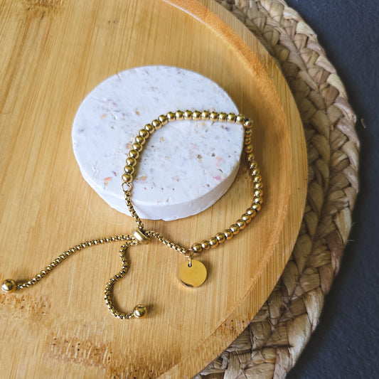 Adjustable gold beaded bracelet