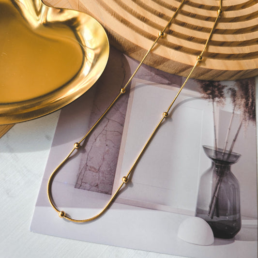 Round bead gold snake necklace